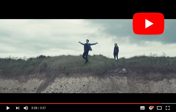 Singer stood on cliff in music video filmed by drone
